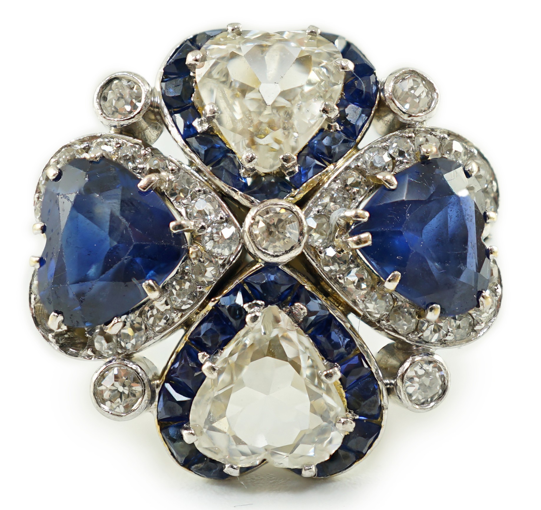 An attractive 18ct white gold, two stone heart shaped diamond and two stone heart shaped sapphire set cluster ring